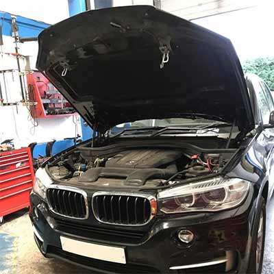 BMW with the bonnet raised at Independent Vehicles in Altrincham